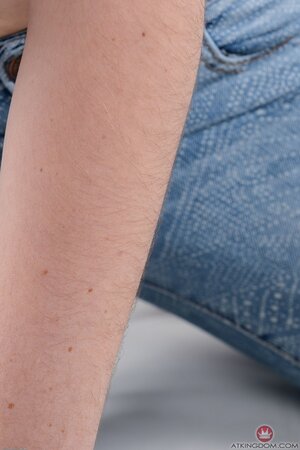 It isn't a problem for pale-skinned cutie to expose hairy pussy on camera