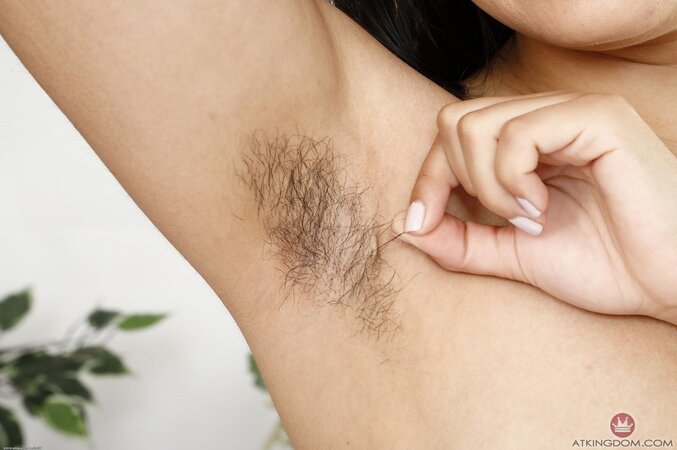 Brunette whore exposes her hairy pussy and asshole spreading rear wide