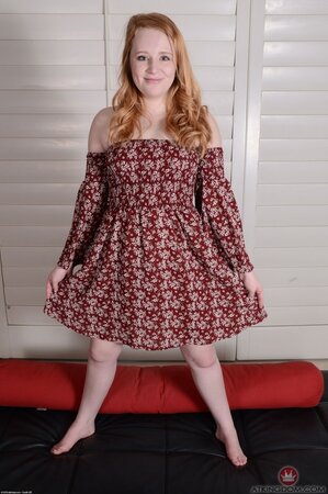 Pale redhead with Pikachu tattoo on right hip willingly spreads snatch