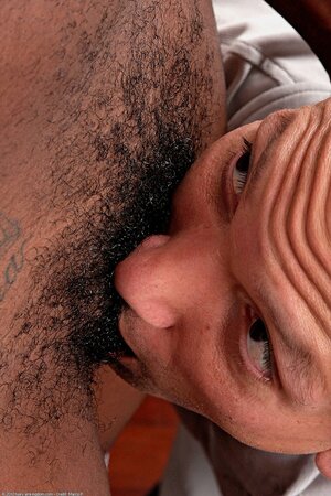 Inviting black female gives sexual pleasure to a white man with her hairy cherry
