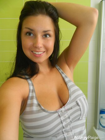 American teen with dark hair takes pictures of awesome titties in the bathroom