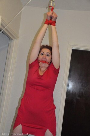 Woman in red dress is restrained by husband for being a bad wife and sex partner
