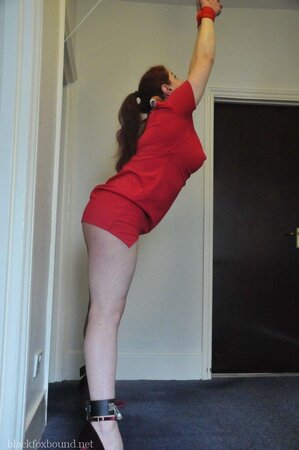 Woman in red dress is restrained by husband for being a bad wife and sex partner