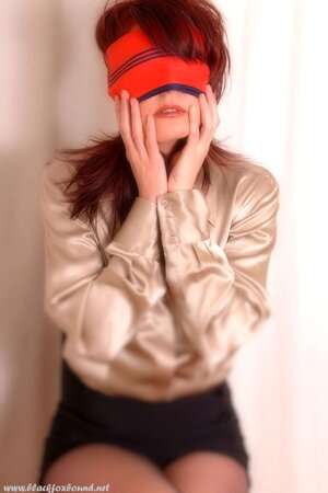 Compilation of porn pics of a pornstar with red hair being hogtied and blindfolded