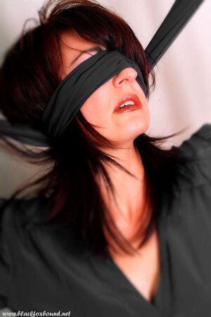 Compilation of porn pics of a pornstar with red hair being hogtied and blindfolded