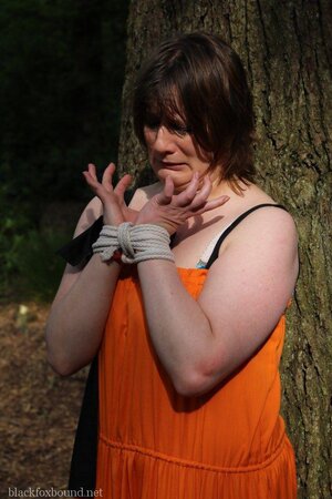 Helpless housewife is captured by lover and tied up to tree in public park