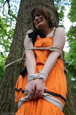 Helpless housewife is captured by lover and tied up to tree in public park
