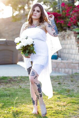 Colleen in white has a tattooed body including nipples to expose outdoors