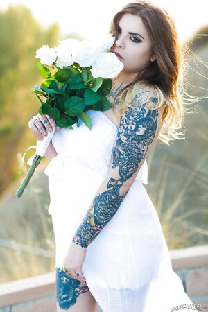 Colleen in white has a tattooed body including nipples to expose outdoors