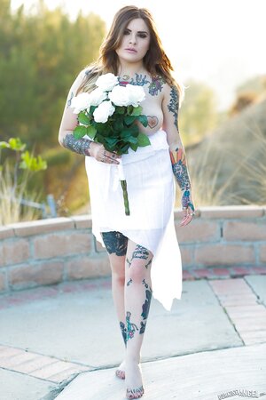 Colleen in white has a tattooed body including nipples to expose outdoors