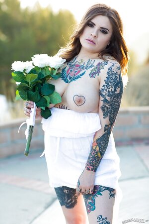 Colleen in white has a tattooed body including nipples to expose outdoors