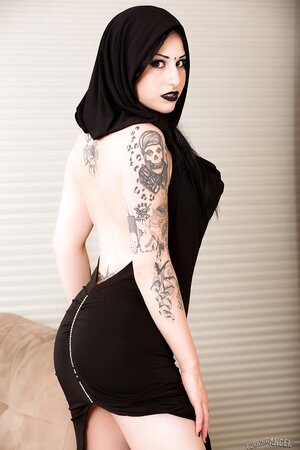 Pale-skinned brunette girl wears only black and masturbates on the floor