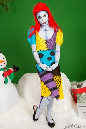 Pornstar with fiery red hair looks fuckable even when cosplaying a zombie