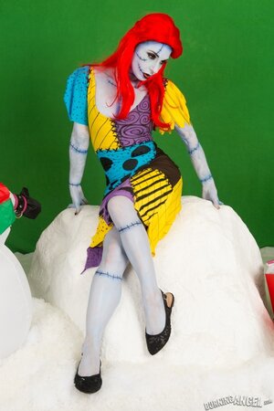 Pornstar with fiery red hair looks fuckable even when cosplaying a zombie