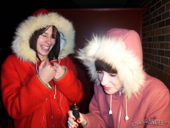 Lovely girls drink beer outdoors and this makes them eager to touch each other