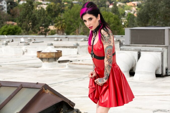 Whore with pink locks in a red vinyl dress goes outdoors for a naked photoshoot