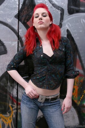 Pale-skinned redhead deletes the rock'n'roll panties and demonstrates her pussy