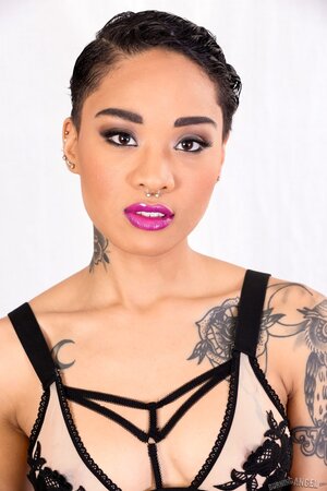 Solo gallery of a smoking-hot Asian girl with nose piercing and tattoos