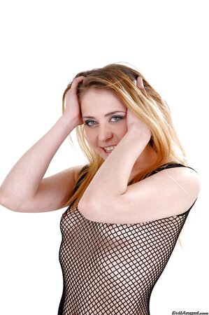 Russian woman takes her green stockings and panties off leaving fishnet dress on