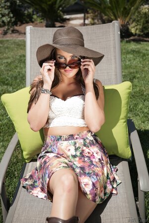 Rude MILF with a hat is shaded outdoors flaunting her tits and pussy