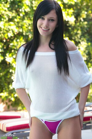 Slender brunette Catie Minx loves relaxing without panties by the pool