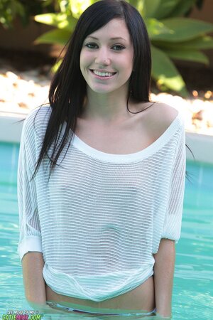 Slender brunette Catie Minx loves relaxing without panties by the pool