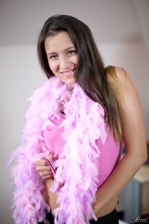 Teen dreams about big career while posing nude with a boa wrapped around her body