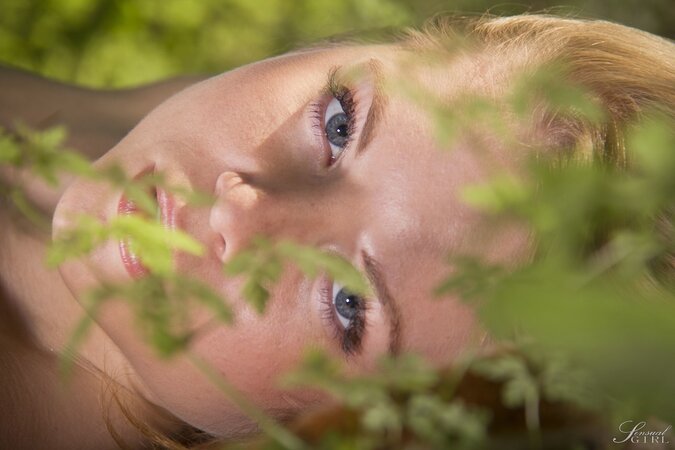 Outstanding girl feels unity with nature by taking off her lingerie in the forest