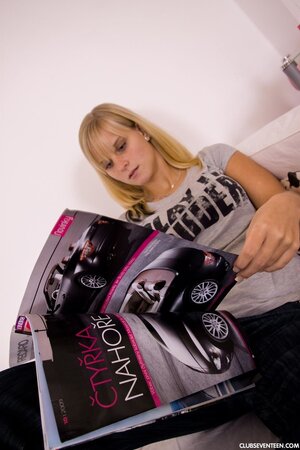 Young blonde with huge boobs licks a glass dildo and drives it into sugar twat