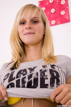 Young blonde with huge boobs licks a glass dildo and drives it into sugar twat