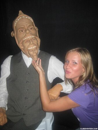 Blonde girl thinks about sex even when she is at the exhibition of wax figures