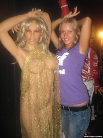 Blonde girl thinks about sex even when she is at the exhibition of wax figures