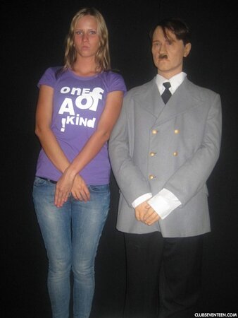 Blonde girl thinks about sex even when she is at the exhibition of wax figures