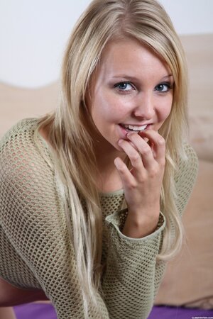 Excited chick in green fishnet long sleeve top has the bumpy dildo at hand