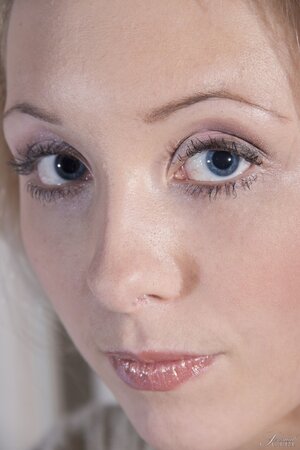 Cutie with thin eyebrows and blue eyes spreads shaved pussy for guys