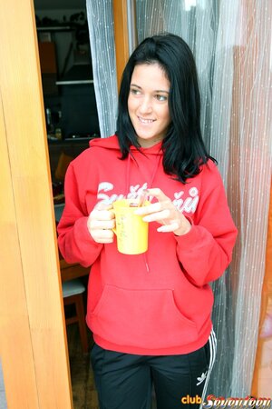 Sportsgirl in red hoody has a tradition of masturbation after morning workout