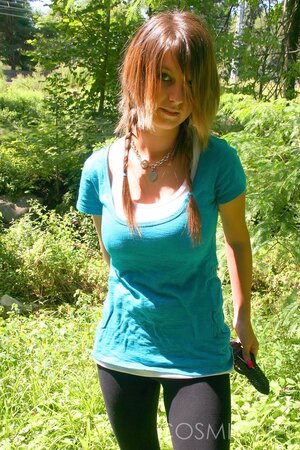 Slim hussy with sexy piercing shows her enormous tits on a sunny day outdoors