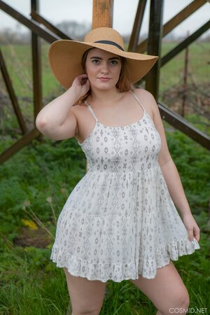 Hot country girl reveals her huge natural boobs and plump buttocks outdoors