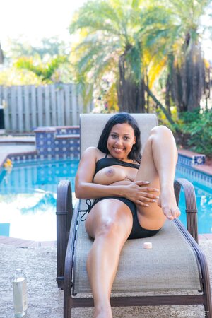 Stunning black BBW takes off swimsuit and teases with her big tits by the pool