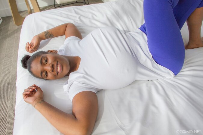 Ebony hottie reveals her impossibly-huge natural breasts for the camera