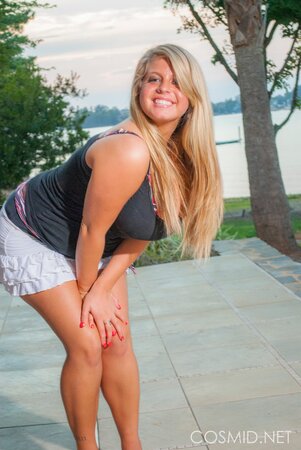 Sexy blonde BBW disrobes unveiling her immense tits and ass outdoors