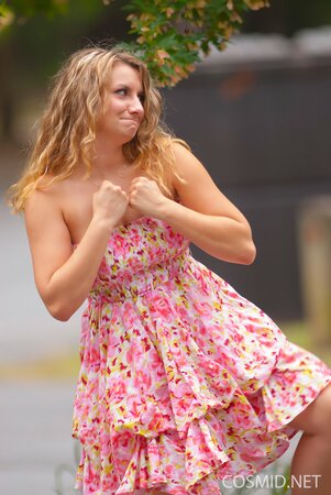 Beauty with wavy hair flashes her natural tits and lovely ass outdoors