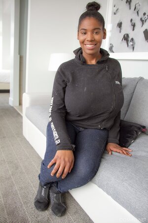 Amateur Ebony fatty in jeans unveils her impossibly-huge breasts for the camera