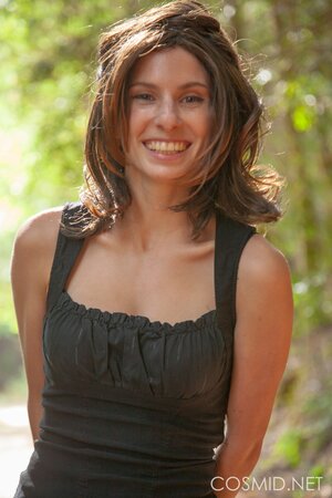 Slim country girl gets topless to reveal her fantastic big breasts in the woods