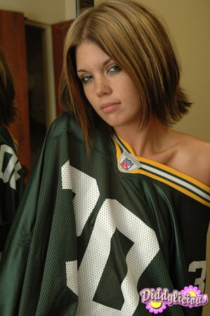Football fan undresses and covers pussy using a piece of artificial cheese
