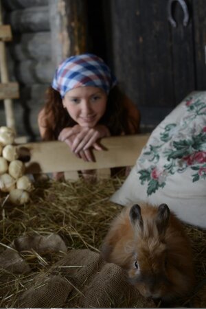 Farmer's playful daughter fools around naked with animals in the barn