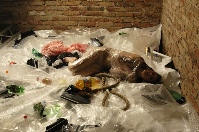 Naked girl hotly frees tempting body from restrictive tape covering her tightly