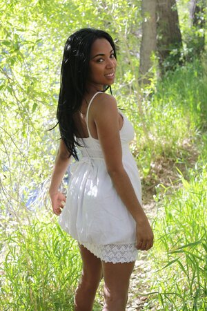 Black hottie takes off white dress to reveal perfect big breasts in the woods