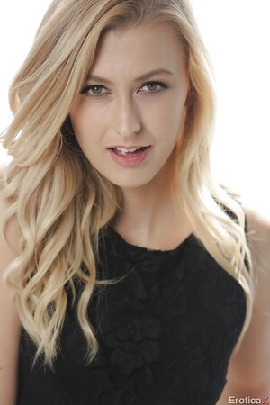 Towheaded erotic model strips slowly to reveal her nudity on the roof