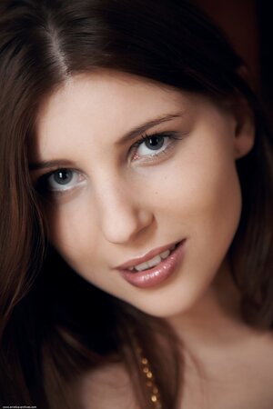 Winsome teenage brunette willingly shows off her fantastic big tits in the house